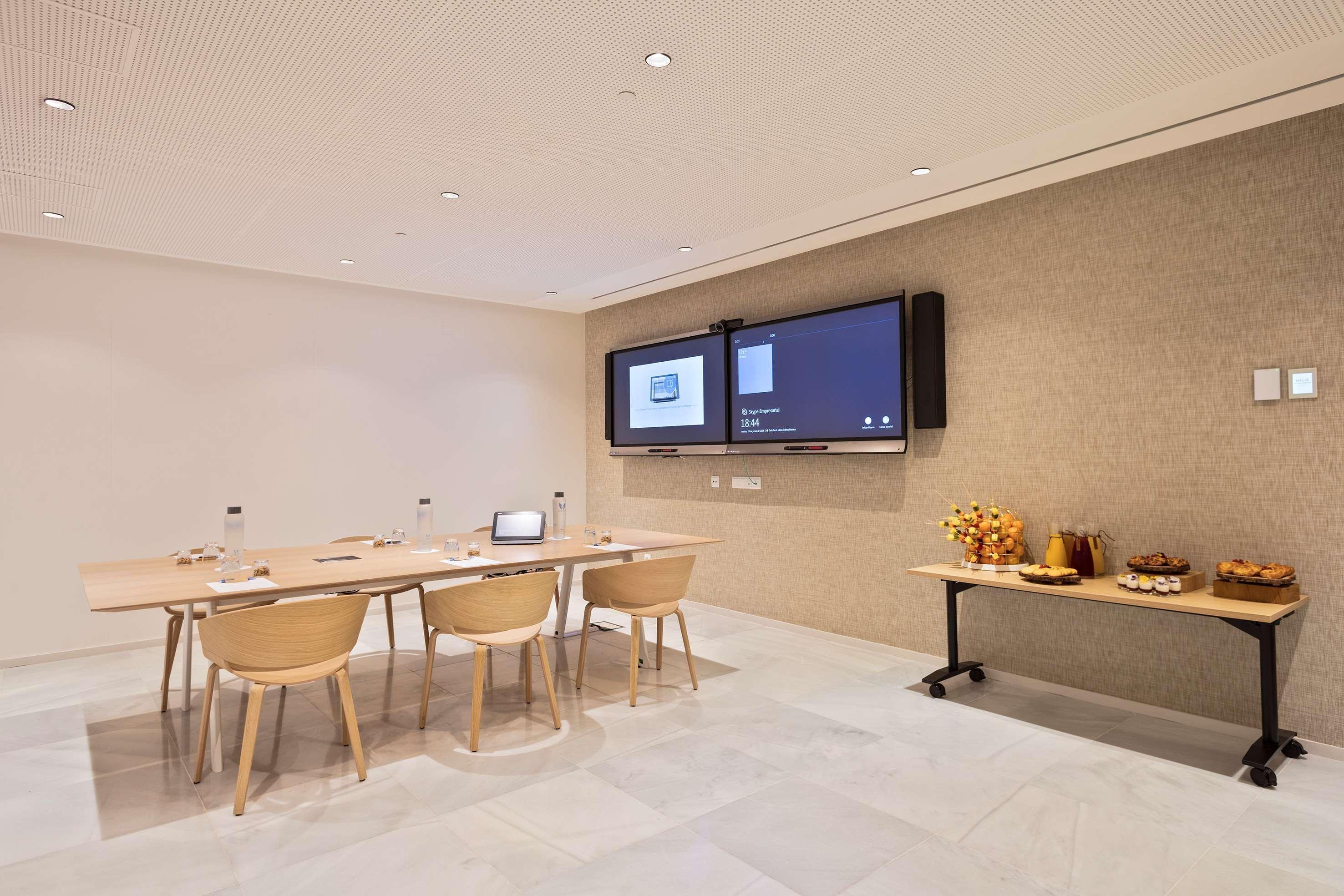 Melia Palma Marina Hotel Exterior photo Meeting room with a video conference system